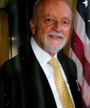 Joel M. Cohen Attorney's portrait with American flag